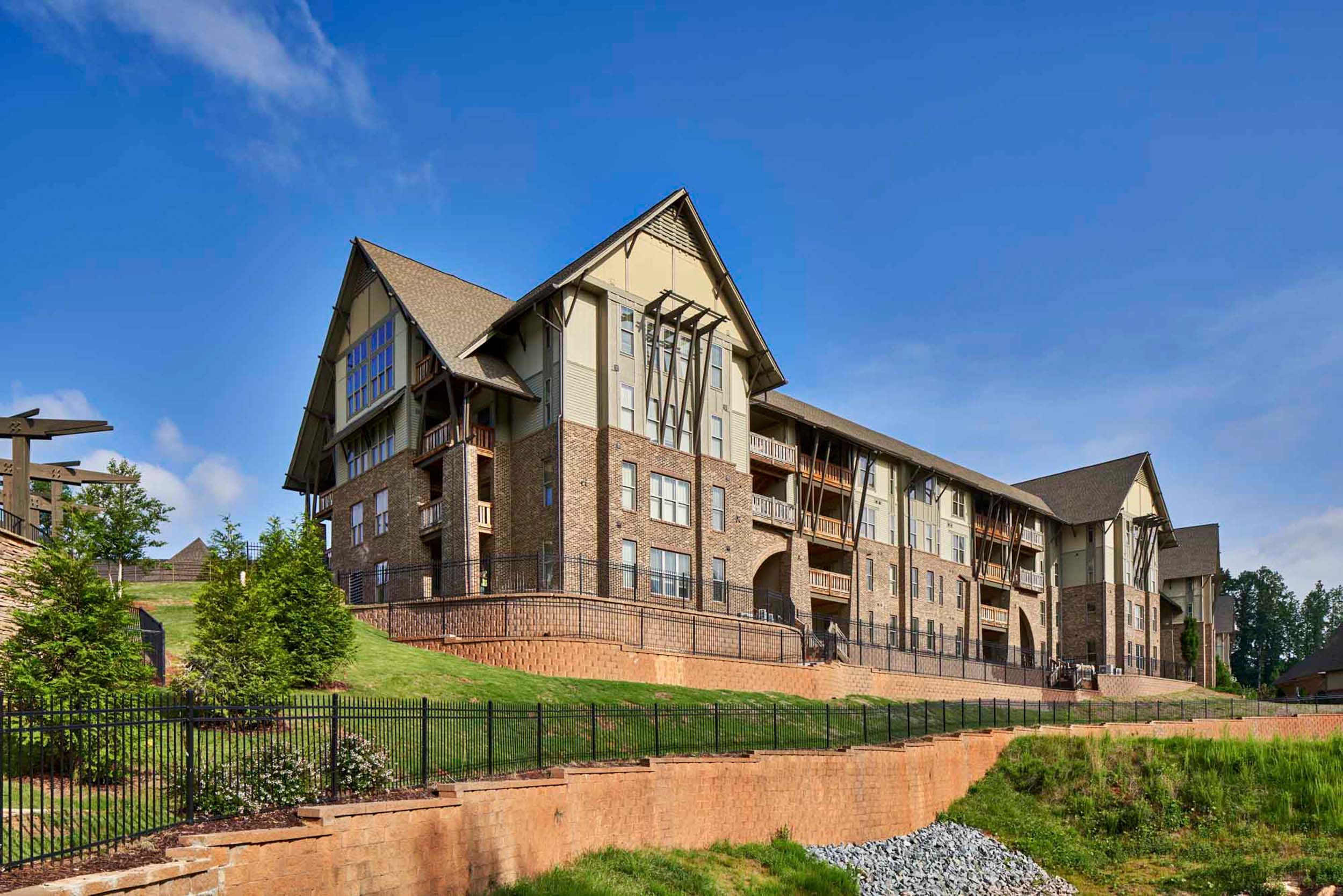 Four story brick and beige apartment building