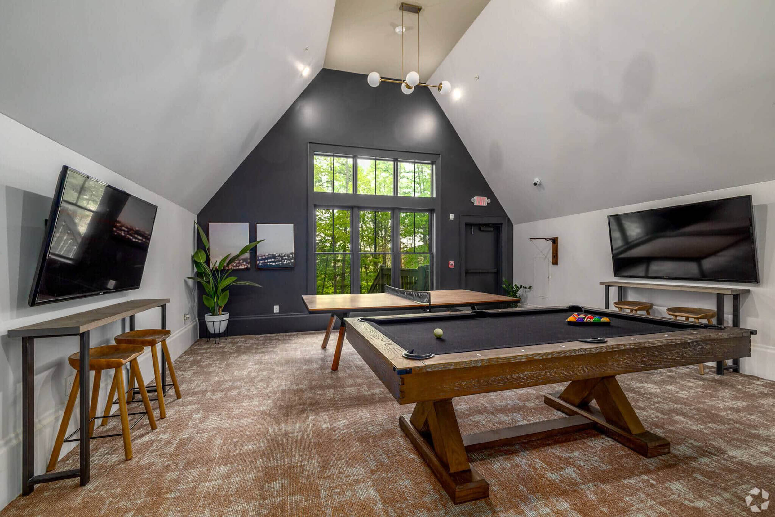 Game room with TVs billiards and ping pong